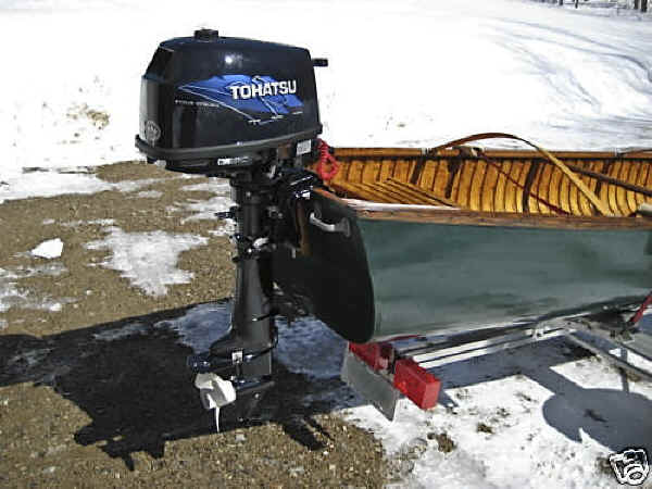 Trailex SUT-200-S Trailer Shown With Wood Canvas Canoe and Mounted Motor