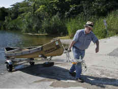 Trailex SUT-200-S Trailer with Sportspal Canoe - Launching by Hand